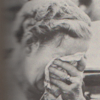 a woman weeps near the entrance of the Coalbrook mine