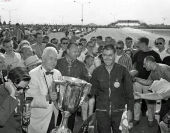 Harry Carter getting the Vanderbilt Cup from Cornelius Vanderbilt IV