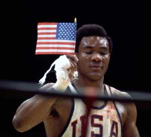 Foreman celebrating his Olympic gold medal win