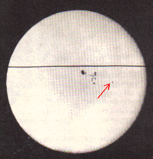 Mercury (at the red arrow) passes in front of the Sun only 12 or 13 times each century