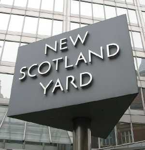 sign in front of The New Scotland Yard building